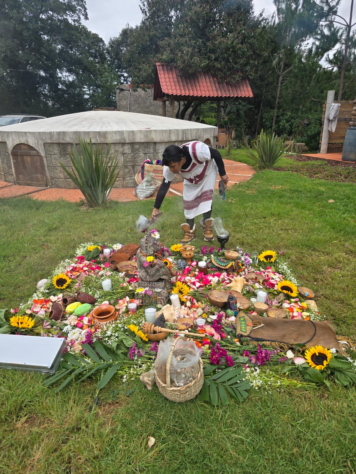 Indigenous ceremonial altar with flowers and sacred offerings